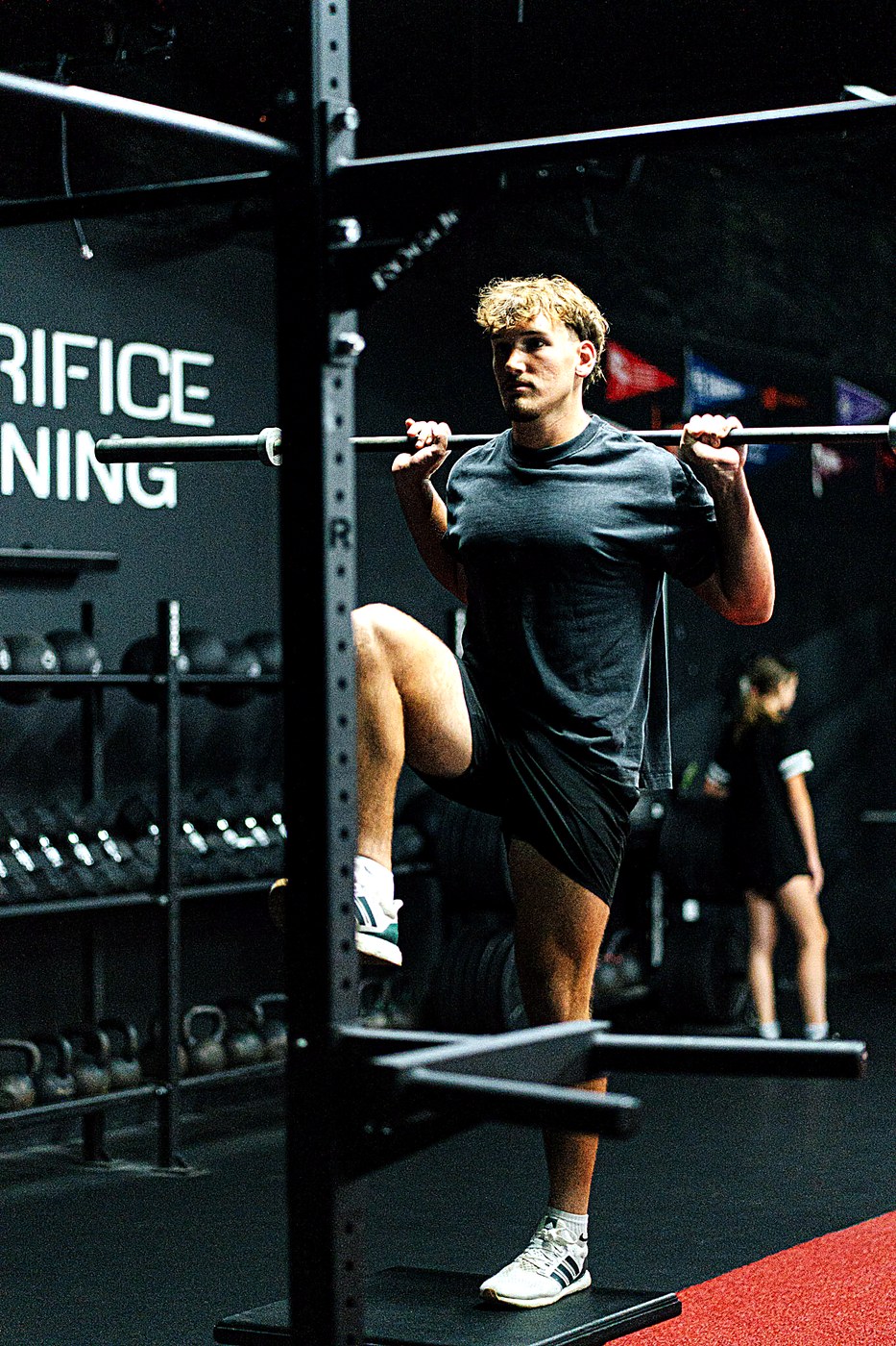 Olyfit member training with a barbell at Sacrifice Training